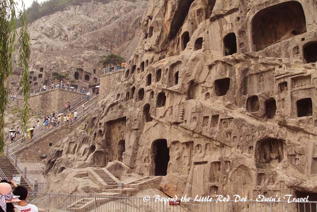 Longmen Grottoes runs along the river and is a series of caves with Buddhist art carved into the cliff face.
